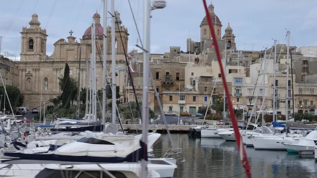 Birgu, Malta travel - Yachts and boats moored to the quay embankment
