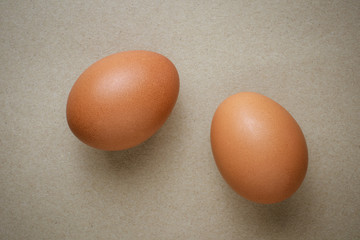 Brown chicken eggs on recycled craft paper