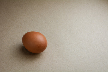 Brown chicken eggs on recycled craft paper