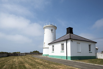 Fototapeta na wymiar A lighthouse on a beautiful coastline (nash point ) 