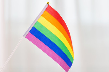 gay pride, homosexual and lgbt concept - close up of rainbow flag