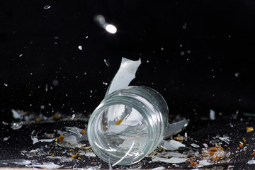 Shot in studio on glass against black background with flash light
