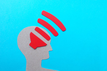 Sound wave human brain, blue background, cardboard and paper image