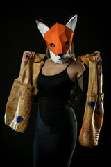 Blonde Girl in Black Evening Office Dress with Fox Mask paper Using Pig Skin for Covering.