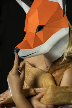 Thinking about Animal Protection. Blonde Girl with Fox Mask paper Using Pig Skin for Covering. Fashion