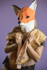 Blonde Girl in Seethrow Dress with Fox Mask paper Using Pig Skin for Covering. Dead Animal Consuming