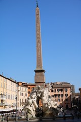 Fototapeta premium Obelisco Agonale and Fountain of the Four Rivers at Piazza Navona in Rome, Italy 