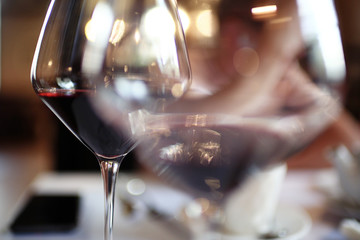 Wine-glasses on the table blurred