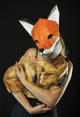 Blonde Girl with Fox Mask paper Using Pig Skin for Covering. Dead Animal Consumer