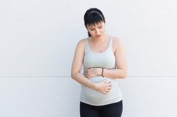 Pregnant woman feeling pain