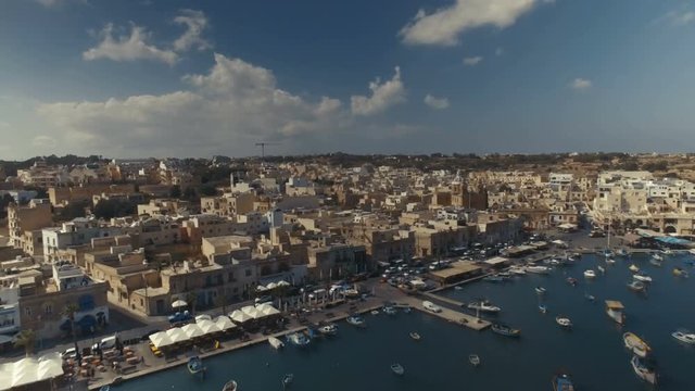 Drone shot flying backwards over Marsaxlokk