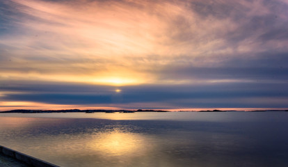 Fototapeta na wymiar Setting sun glowing with beautiful colors,Saltholmen,Gothenburg,Sweden