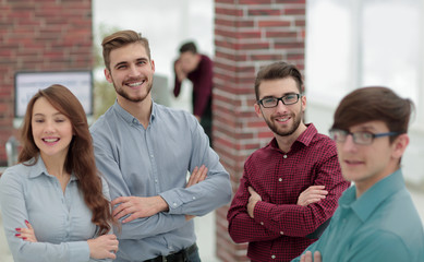 Happy smiling business team in office.