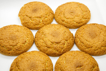 Oat cookies are lying on a white background