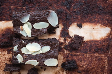 Dark chocolate brownies with almond topping.