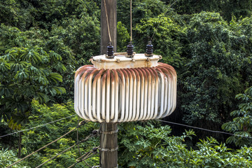 Electric power transformer on a pole