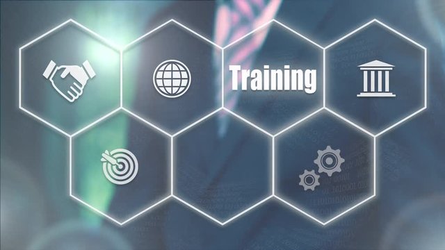 A businessman's hand selecting a Training concept button on a futuristic computer screen.