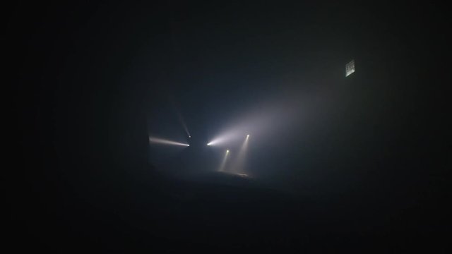 Rescue forces search for survivers inside a dark tunnel using flashlights
