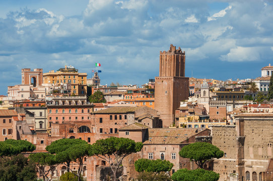 Rome historic center old skyline with medieval Tower of Militia and Quirinal Hill Tower of the Wind above Imperial Fora ruins