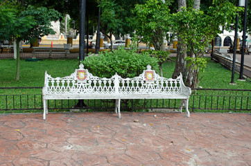 White metal bench in the park