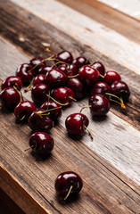  Fresh cherries on wood table.