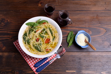 Plate of soup with cherry tomatoes and pecorino   