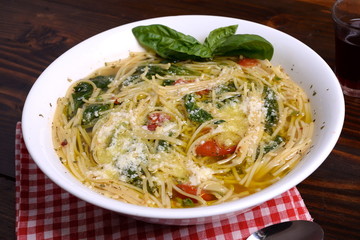 Plate of soup with cherry tomatoes and pecorino   