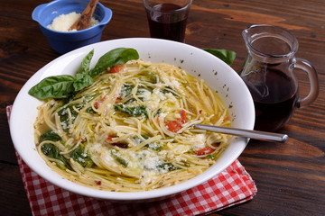 Plate of soup with cherry tomatoes and pecorino   
