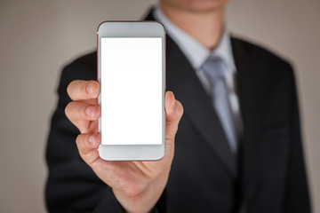 Businessman hold and show white screen of smartphone display for input free space as business, technology, communication and advertising concept