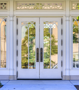 Reflective Glass Windows On Outside Wooden Door