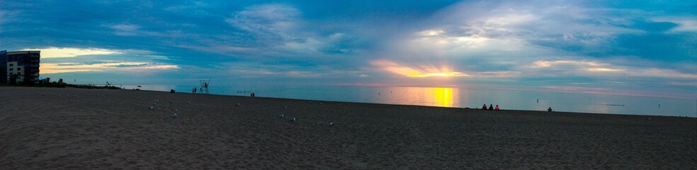 Storm Clouds Over a Sandy Beach at Sunset - Grand Bend, Ontario, Canada. PANORAMA FORMATTING