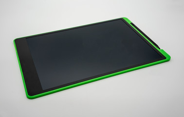 Black and green LCD writing pad tablet isolated on white