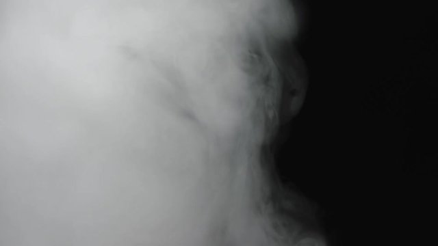 White smoke in front of black background