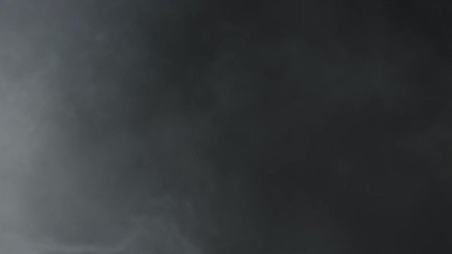 White smoke in front of black background