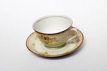 A porcelain tea cup in a saucer