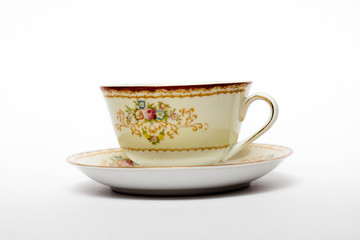 A porcelain tea cup in a saucer
