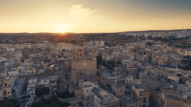 High Aerial shot over Qormi at Sunset