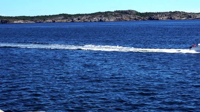 Boat, motorboar or speedboat passing by in kjerringvik norway,