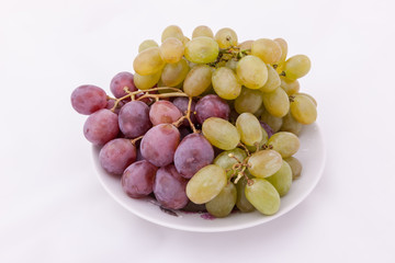 bunches of purple and green grapes