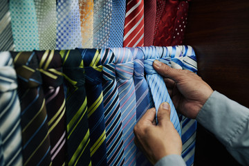 Man choosing tie