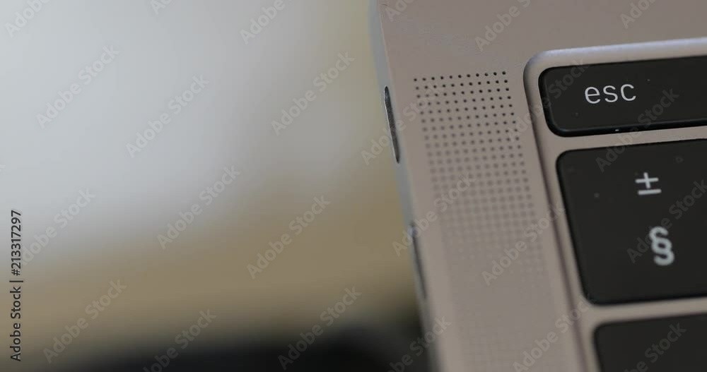 Poster Removing a USB type C cable from a laptop computer.