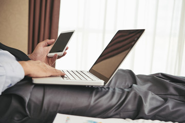 Fototapeta premium Businessman using gadgets in work