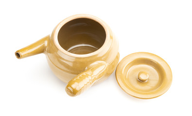 clay pot for boilding herb medicing with the lid open on white