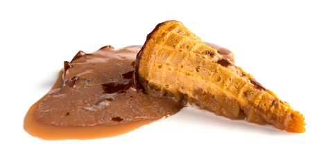 side view chocolate flavor ice cream cone melted on white background