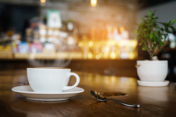 coffee latte with smoke on table in cafe shop. coffee break and relaxing concept.