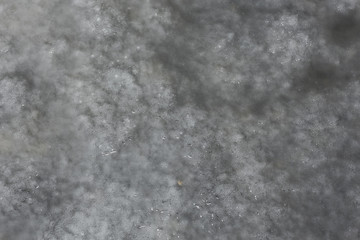 abstract winter background / gray ice with snow, background for text. abstract background cold with snowfall.