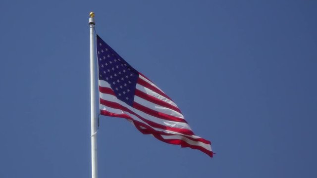 USA Flag waving blue sky 1