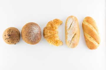 Different kinds of bread isolated on white background