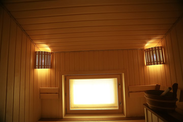 sauna, wooden interior baths, wooden benches and loungers accessories for sauna, spa complex in the hotel