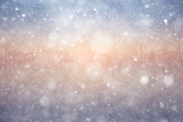 Snowfall texture of snowflakes on blurred background